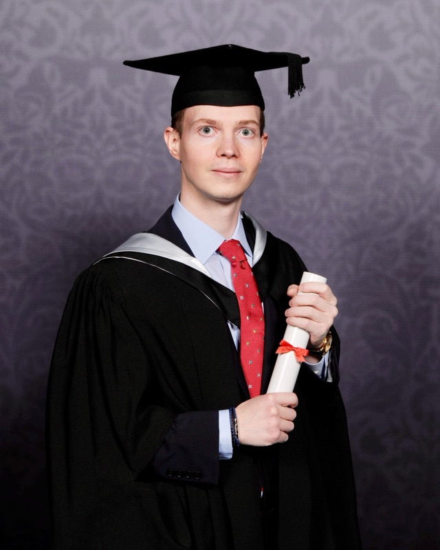 Dimitrios Magouliotis in academic dress at graduation.